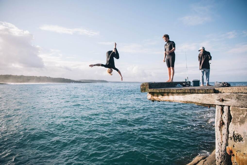 Jumping off the old Bawley Point gantry was not encouraged but it seemed everyone did it. This photo was taken before a storm destroyed the platform in June. Photo: Aletheia Minassian.