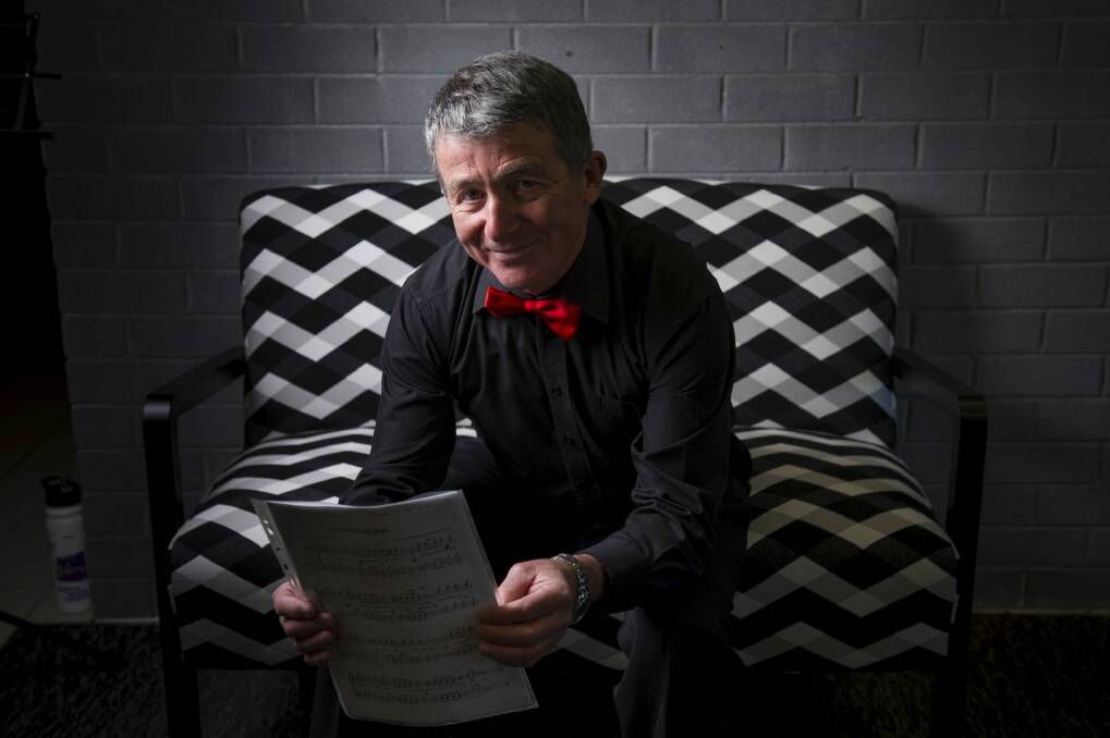 Chris Drury from Shiraz vocal group with the lyrics for the song he wrote about the new furniture range. Photo:  Rohan Thomson