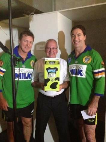 Raiders coach David Furner, left, with Raiders legend Bradley Clyde, right, wearing old Canberra jerseys to help launch Raiders Lime Milk, with Canberra Milk managing director Garry Sykes.