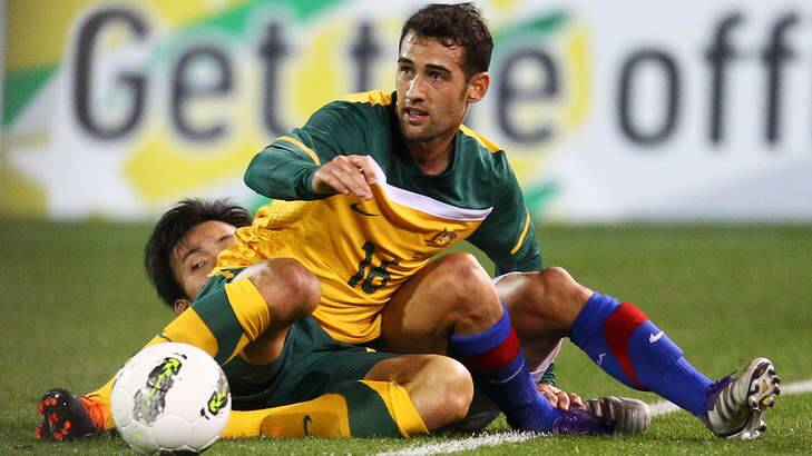 Socceroos player and Canberran Carl Valeri makes a challenge against Malaysia at Canberra Stadium in 2011. Photo: Getty Images
