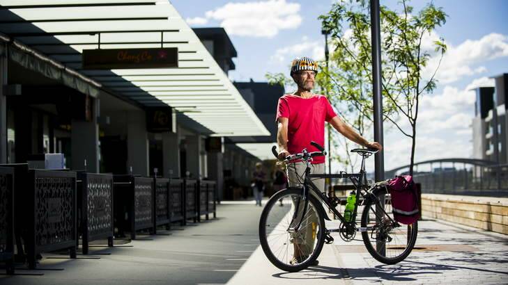 MIXED USE: Pedal Power spokesman Jeff Ibbotson with his bicycle close to some of the outdoor dining at the Kingston Foreshore. Photo: Rohan Thompson
