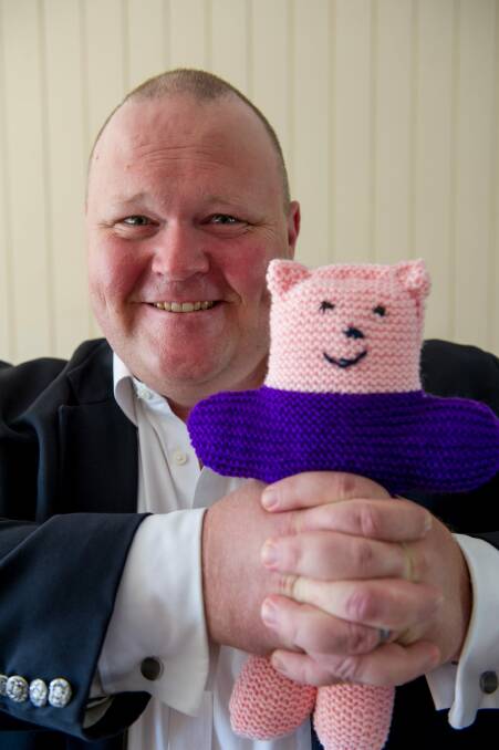 ACT Liberal candidate Paul Sweeney, with the "trauma teddies" he distributes to victims of crime, this year. Photo: Jay Cronan