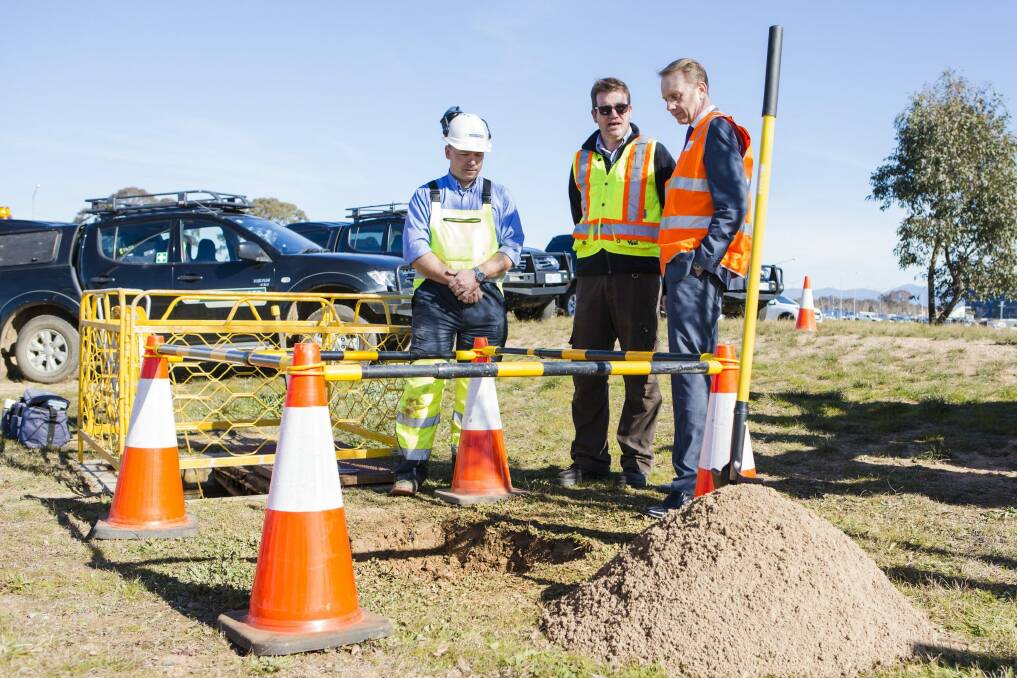 From left, Leach Steger directors  Jason Steger and Chris Leach and Capital Metro Minister Simon Corbell inspect the project's utility investigation works. Photo: Jamila Toderas