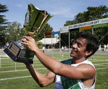 Dean Scarff holds up the trophy after winning the final of the Queanbeyan Gift. Photo: Jeffrey Chan