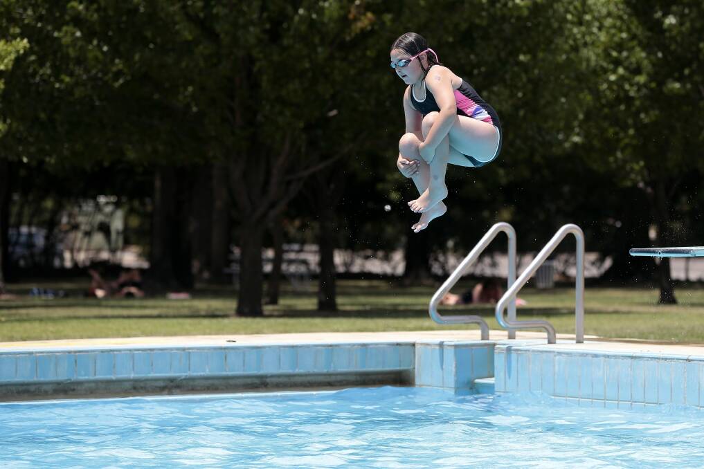 Eliza Chalmers, 8, of Wanniassa cooling off at Canberra Olympic Pool in Civic. Photo: Jeffrey Chan