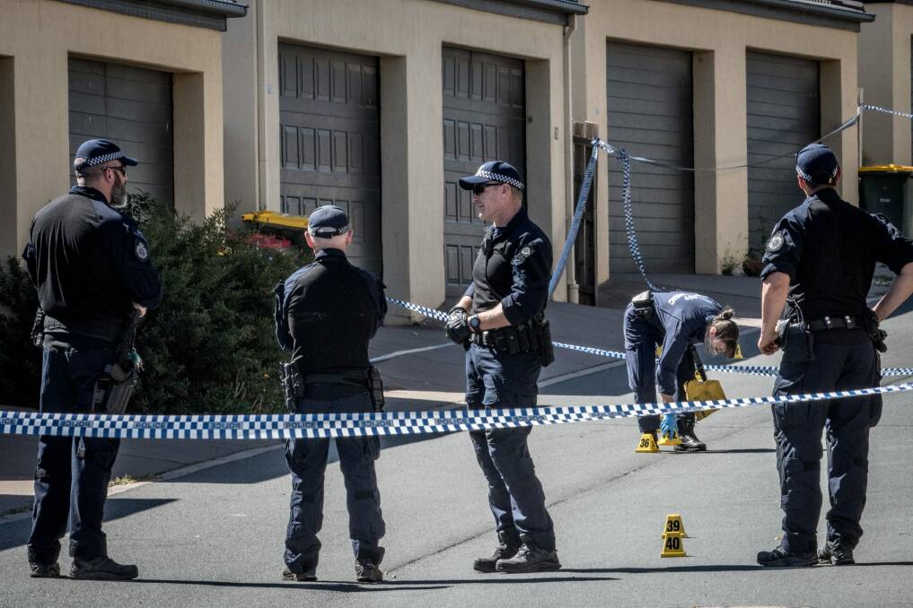 Police investigating at the scene of the alleged murder. Photo: Karleen Minney
