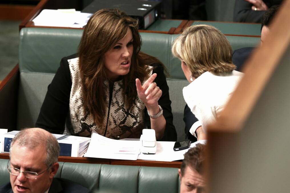Peta Credlin, chief of staff to Prime Minister Tony Abbott, in discussion with Foreign Affairs Minister Julie Bishop inside Parliament House in June. Photo: Alex Ellinghausen