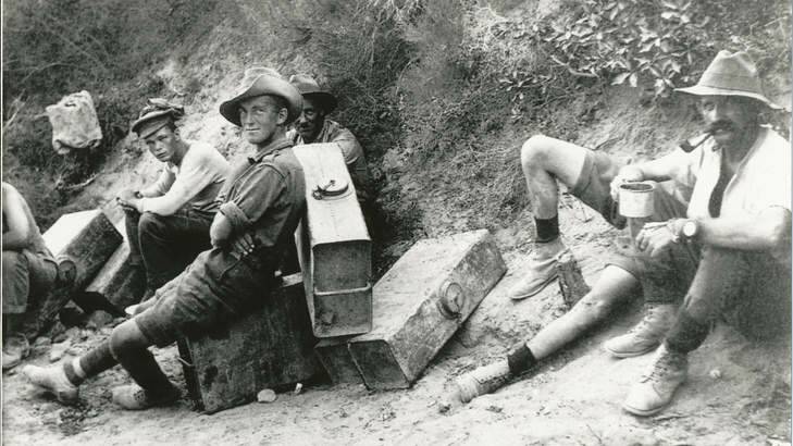 Men of the 6th Field Battery on water-carrying fatigues stop for a rest and a smoke. From <i>Anzac & Empire</i>.