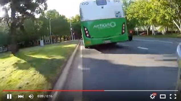 A near miss between a cyclist and a bus in Canberra on February 18. Photo: YouTube