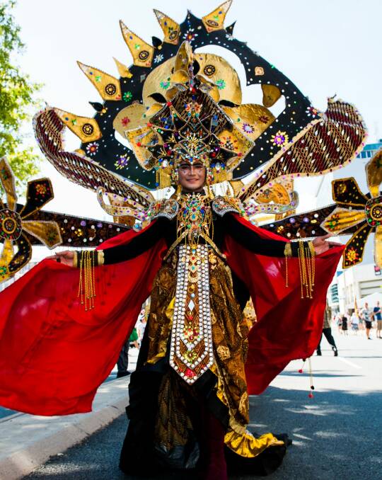 An Indonesian Batik Carnival performer in procession on London Circuit. Photo: Elesa Kurtz