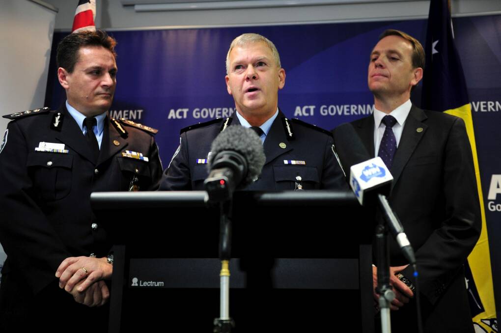 Changing the guard: Retiring Australian Federal Police commissioner Tony Negus, left, was praised by ACT police chief Rudi Lammers. Photo: Jay Cronan