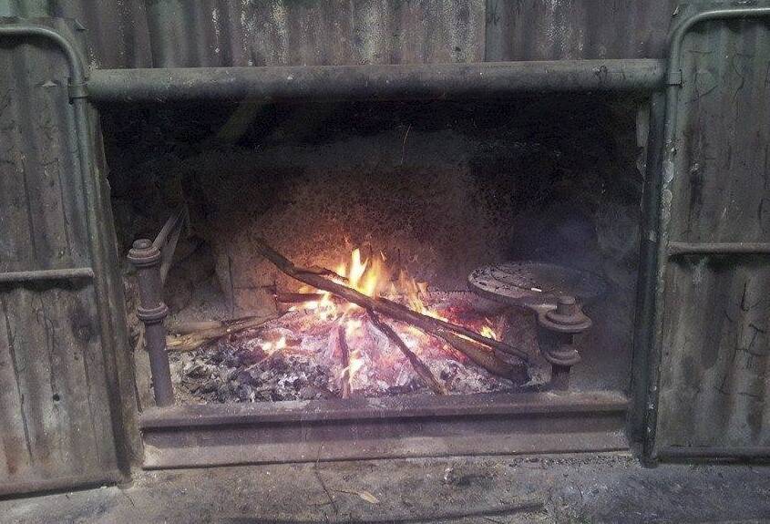 Roaring: The open fire at Blue Range hut. Photo: Jeremy Hagan