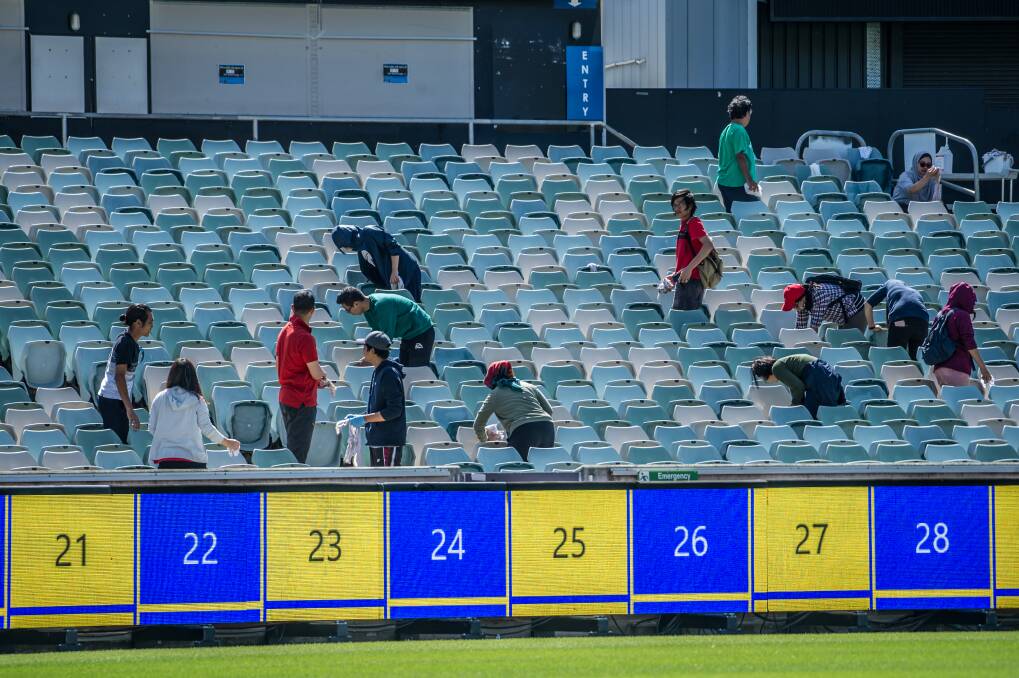 The cleaners put the finishing touches on at Canberra Stadium on Thursday. Photo: Karleen Minney