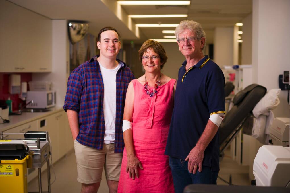 Plasma recipient Tom Levien meets regular donors Lindy Armstrong and Chris Armstrong. Photo: Dion Georgopoulos