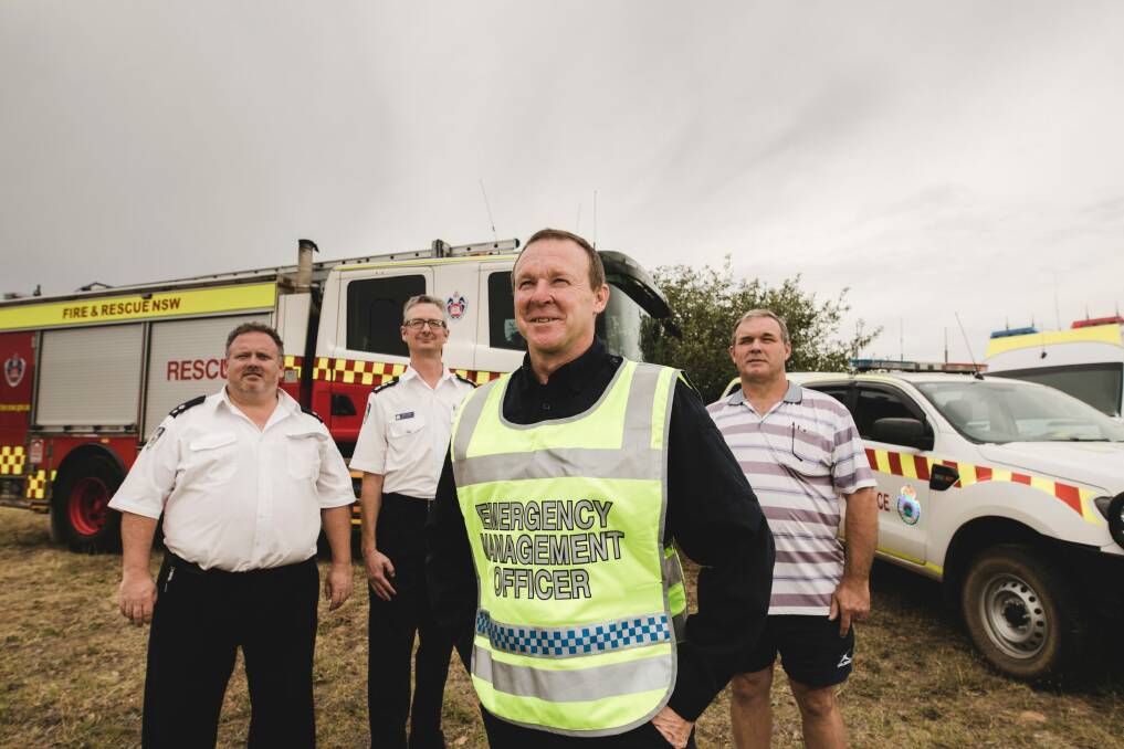 Tim Carroll and  Darren Marks from NSW RFS with NSW Police emergency management officer Paul Lloyd and operations controller Michael Handley. Photo: Jamila Toderas