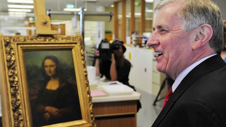 Arts Minister Simon Crean inspects a copy of the famous painting the Mona Lisa at the National Library of Australia, Canberra. Photo: Jay Cronan