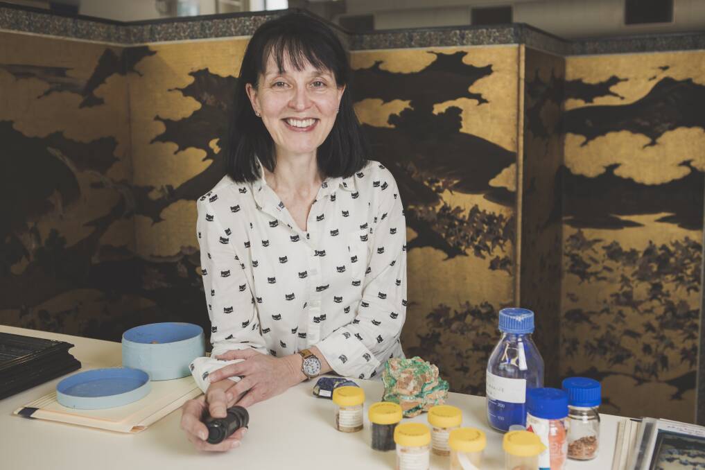Andrea Wise, NGA Senior Conservator of Works on Paper, with a 16th Century Japanese screen, ‘The Imperial Outing and Hunt’ Monoyama Period (1573–1615). Photo: Jamila Toderas