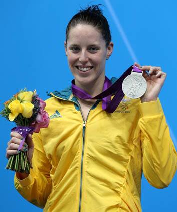 Alicia Coutts shows off one of her silver medals. Photo: Getty Images