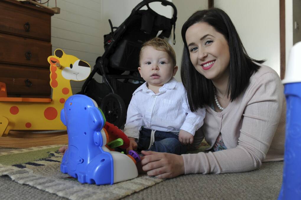 "We have been inundated with requests and interest in the agency," says GLK Elite Nannies founder Georgia King, pictured here with her client's 12-month-old son. Photo: Graham Tidy