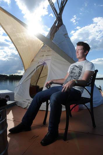 William Woodbridge maintains his tepee raft protest on Lake Ginninderra angered by housing affordability for students in Canberra. Photo: Gary Schafer