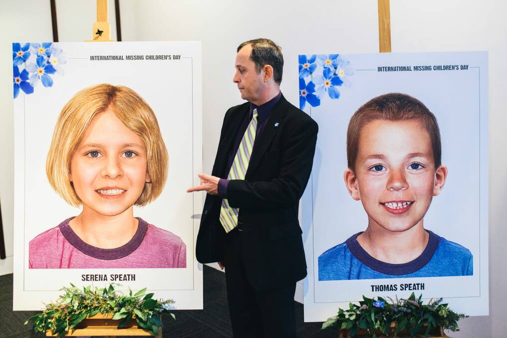 Harry Speath with aged-progessed images of his missing children, Serena and Thomas. Photo: Rohan Thomson