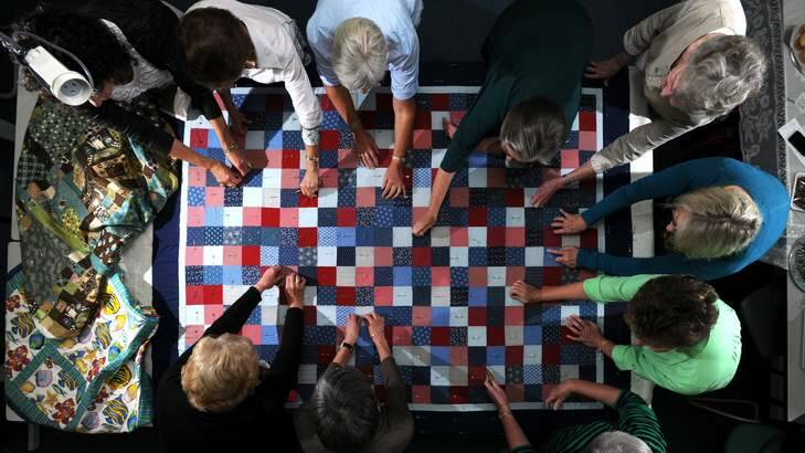 A quilting group, hard at work in Phillip, making quilts for bushfire affected families in Coonabarabran. Photo: Graham Tidy
