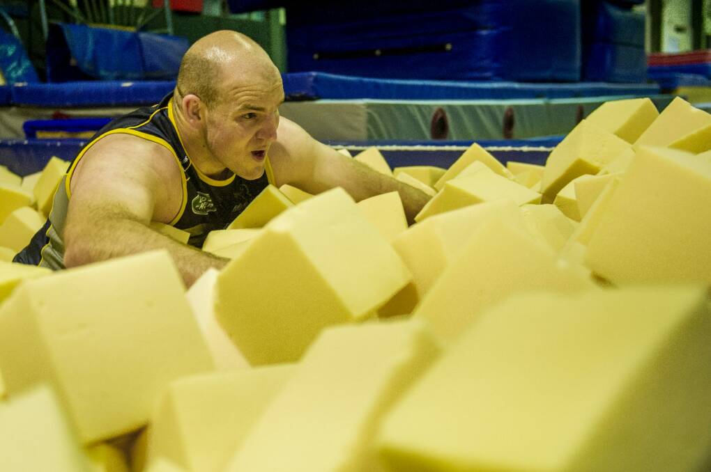 Stephen Moore works out in a foam pit as part of his recovery from knee surgery. Photo: Jay Cronan
