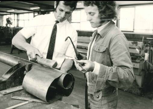 Plumber Malcolm Buckley (right) working with his foreman in the 1970s. Photo: Supplied