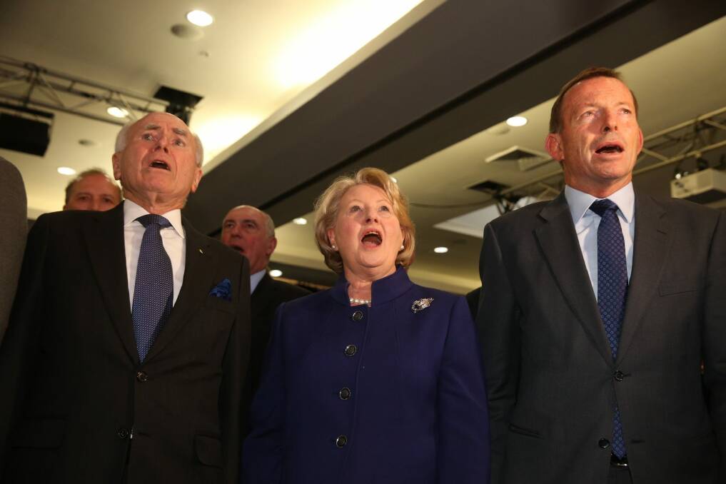John Howard, Janette Howard and Tony Abbott sing the national anthem. Photo: Andrew Meares