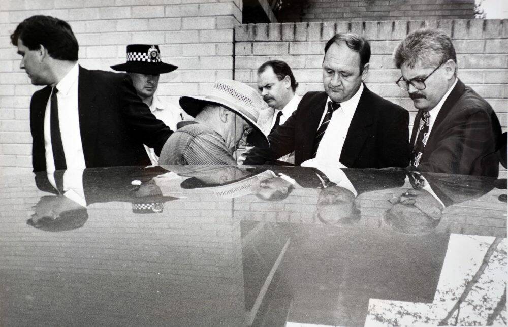 David Eastman, in hat, was arrested for the murder of Colin Winchester in 1992.  Photo: Graham Tidy
