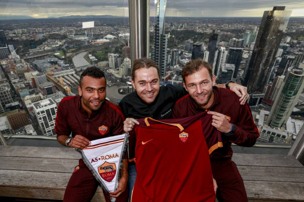 AS Roma players Ashley Cole and Bogdan Lobont at Vue de Monde with chef/owner Shannon Bennett on Wednesday. Photo: Eddie Jim