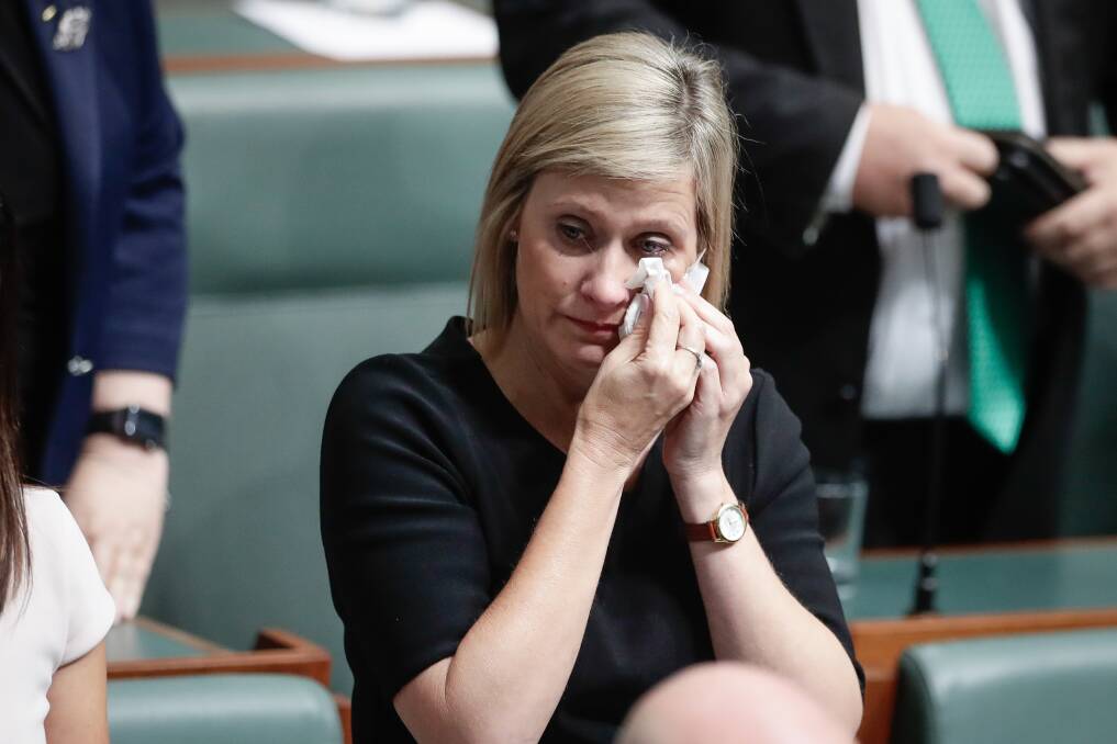 Labor MP Susan Lamb wipes away tears following her speech in the House of Representatives on Wednesday. Photo: Alex Ellinghausen