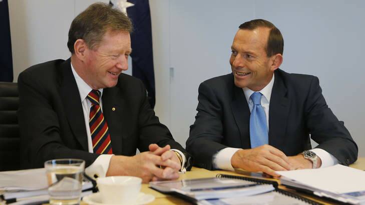 Pay rise: Secretary of the Department of the Prime Minister and Cabinet Ian Watt talks to Prime Minister Tony Abbott. Photo: Getty