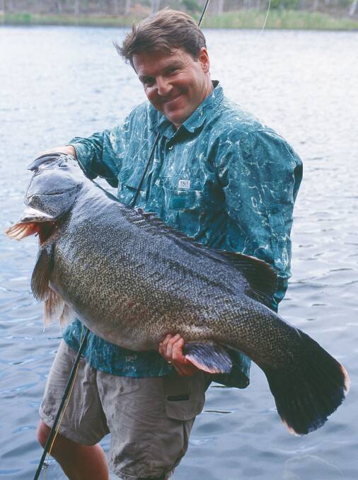 Rob Paxevanos and the giant Murray cod he caught on fly at Googong dam in 2001 Photo: Supplied