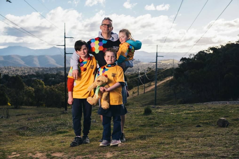 Annabelle Wright, 8, at Mt Taylor. It has been 5 years since she was diagnosed with cancer, and is walking up Mt Taylor everyday in September to raise money for The Kids' Cancer Project. Photographed with her Father David, brother Oliver, 11, and sister Alice, 3. Photo: Rohan Thomson