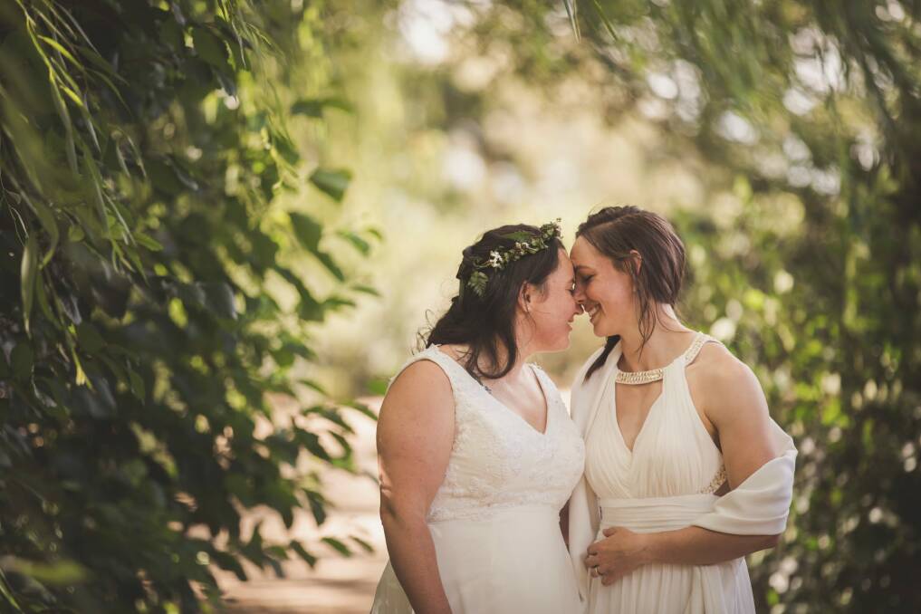 Sally and Kara Bromley share a loving moment on their wedding day. Photo: Jamila Toderas