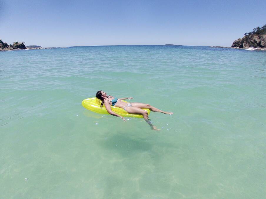 Lisa Kaye of Ainslie soaks up the weather on the South Coast of NSW. Photo: Jay Cronan