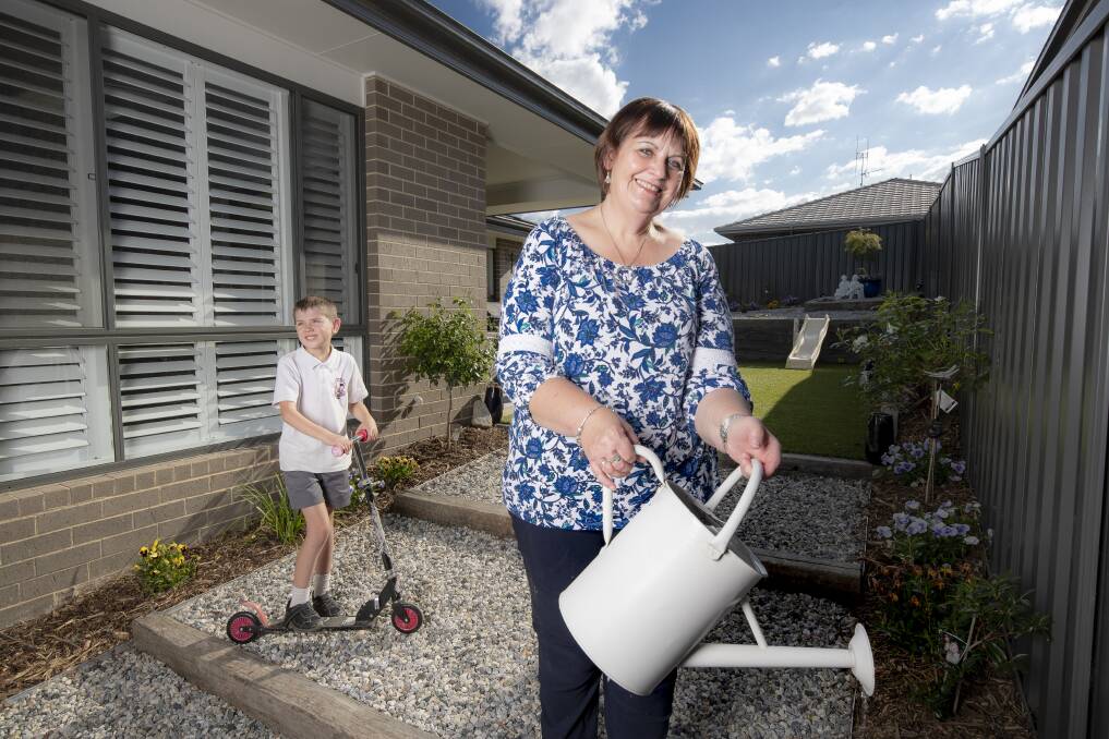 Val Lambert with her grandson Manu Beer at her Googong home.  Photo: Sitthixay Ditthavong