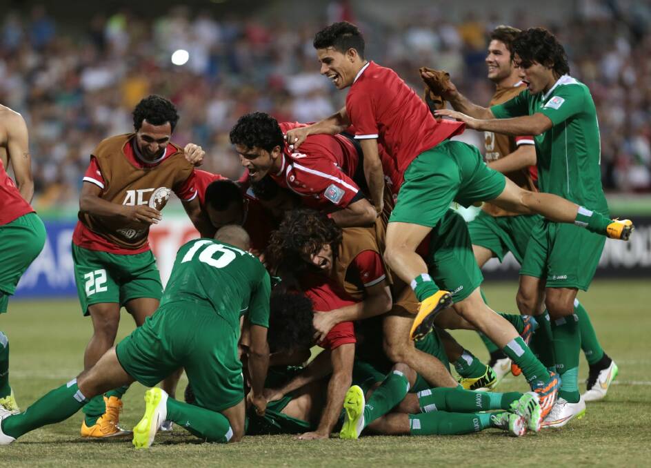 What drama: Iraqi players celebrate their penalty shootout victory over Iran. Photo: AP