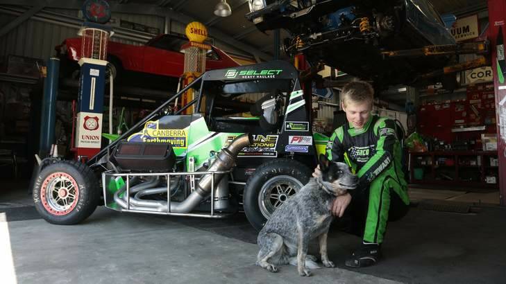 Speedway driver Michael Stewart with his dog Bell. His father says he is safer driving than going to a nightclub. Photo: Jeffrey Chan