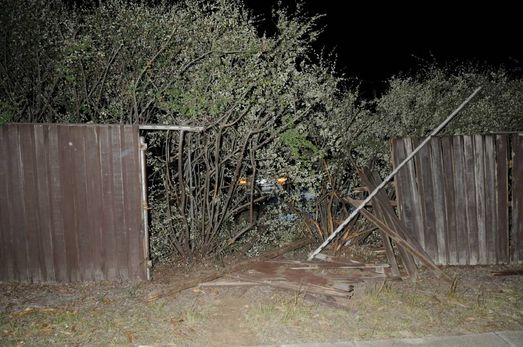 Fence of a Weetangera home smashed after Thursday night crash.  Photo: ACT Police Media 
