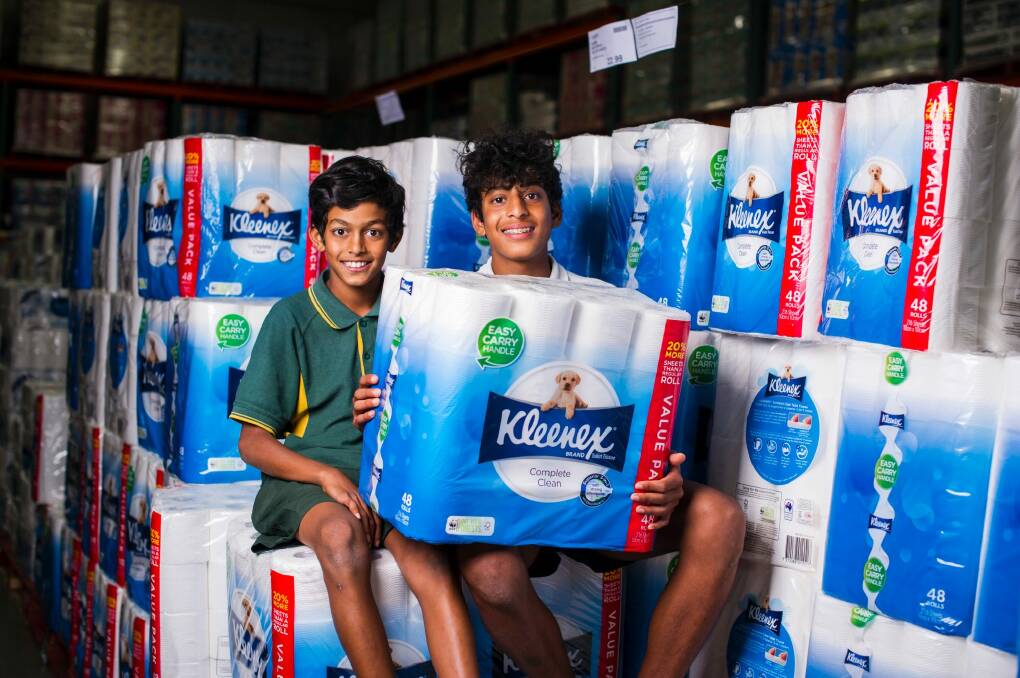 Nathan Mahaarachchi, 11, and Thevin Mahaarachchi, 14, with Kleenex toilet paper.  Photo: Dion Georgopoulos