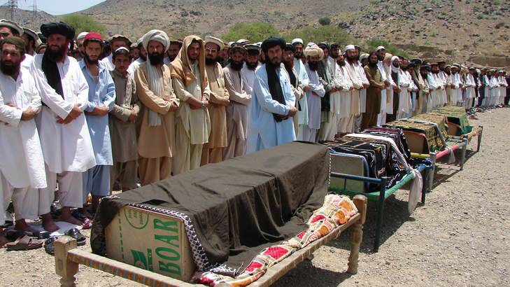 The price: Villagers mourn their dead after a drone attack in Miranshah, North Waziristan. Photo: AP
