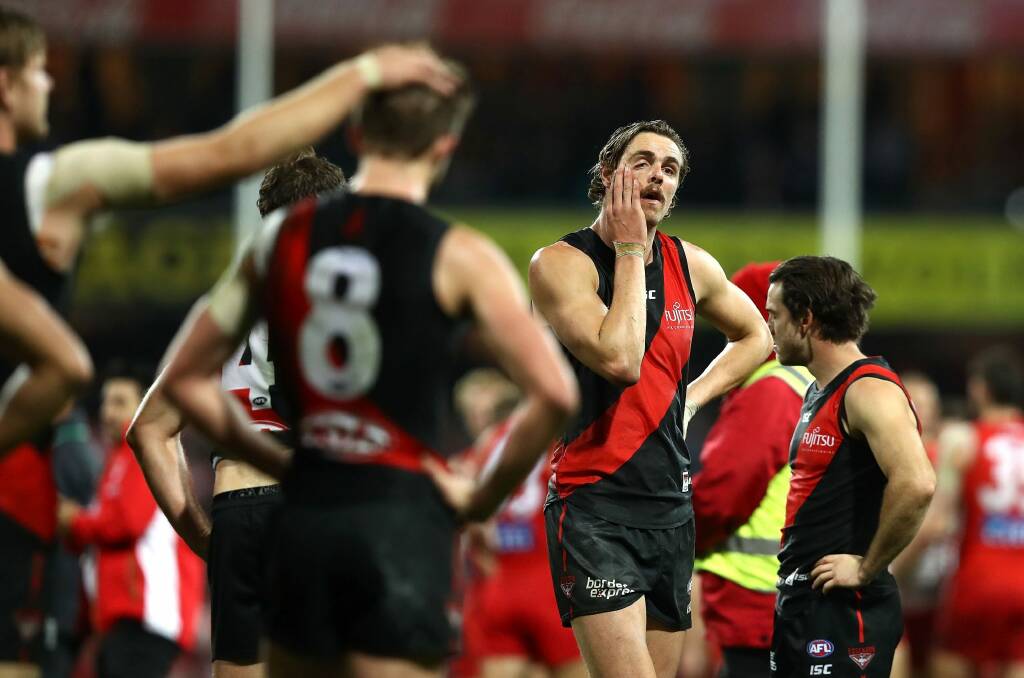 Hard to swallow: Joe Daniher of the Bombers looks dejected after the siren. Photo: Getty Images