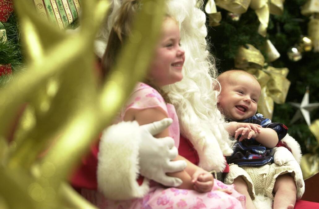 Flashback: Mark  Read,  4 months, of Wanniassa,  is all smiles as he  has   his  picture taken with  sister  Grace, 3,   with  Santa   at the Tuggeranong Hyperdome .