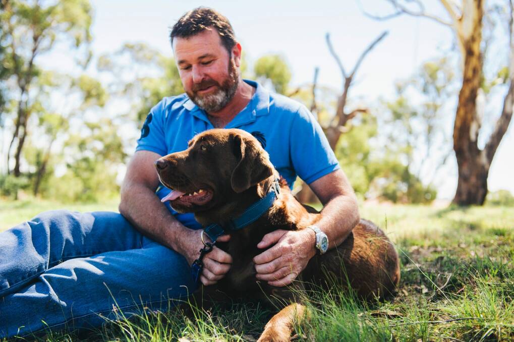 Michael Birchall with his dog Gus. As winners of the people's choice award, the pair were treated to a photo shoot by one of the newspaper's best. Photo: Rohan Thomson
