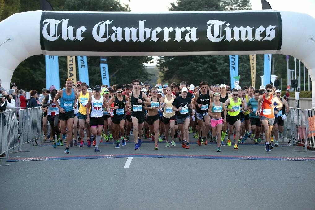 Runners set of the start line at the beginning of the Canberra Times Marathon in front of Old Parliament House.   Photo: Jeffrey Chan
