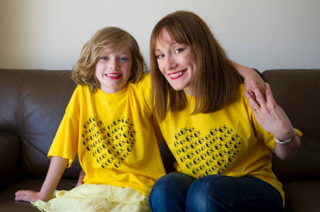Brianna Simpson, 7, and mum Sharon Simpson, are part of family support group Yellow LadyBirds drawing attention to the harm caused by misdiagnosis and delayed support for girls with autism. Photo: Jay Cronan