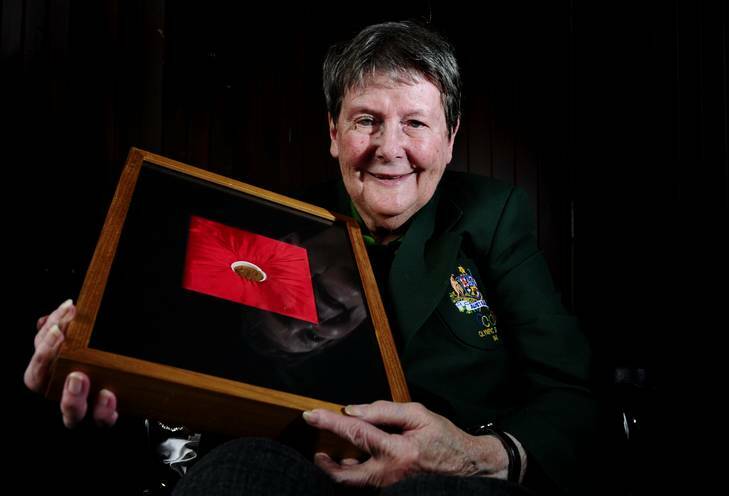 Judy Wilson, a 1948 Olympian in London, holds the only gold medal Australia won at the first London Olympics, for rugby, in 1908. Photo: Melissa Adams