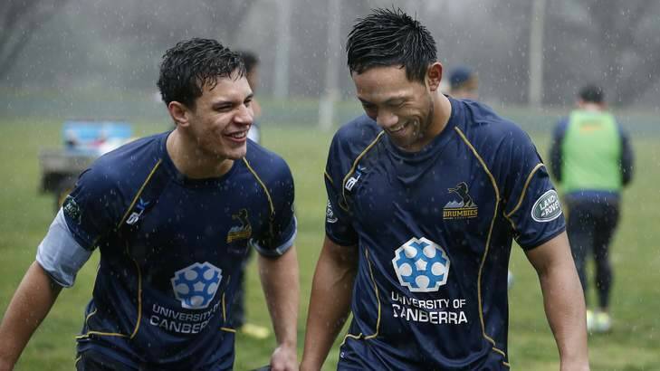 ACT Brumbies players Matt Toomua and Christian Lealiifano after a wet and wild training at Brumbies HQ. Photo: Jeffrey Chan